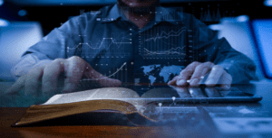 A person interacts with a cutting-edge holographic interface, featuring technology-rich graphs, charts, and a world map. In the foreground, an open book rests on a wooden surface, seamlessly blending traditional and modern elements of information access.