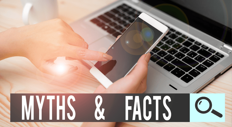 A person uses a smartphone in front of a laptop on a desk. The text “MYTHS & FACTS” with a magnifying glass icon is displayed across the bottom, inviting viewers to uncover common technology myths.